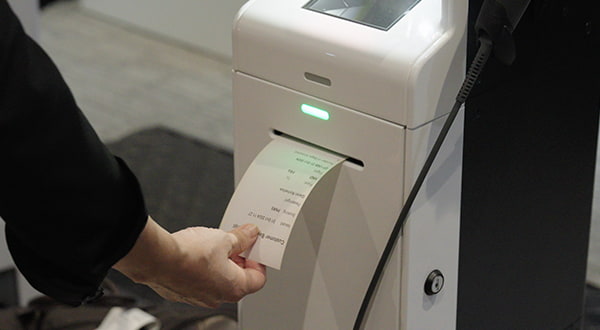 Receive a baggage voucher and hand the bag over to airport staff.